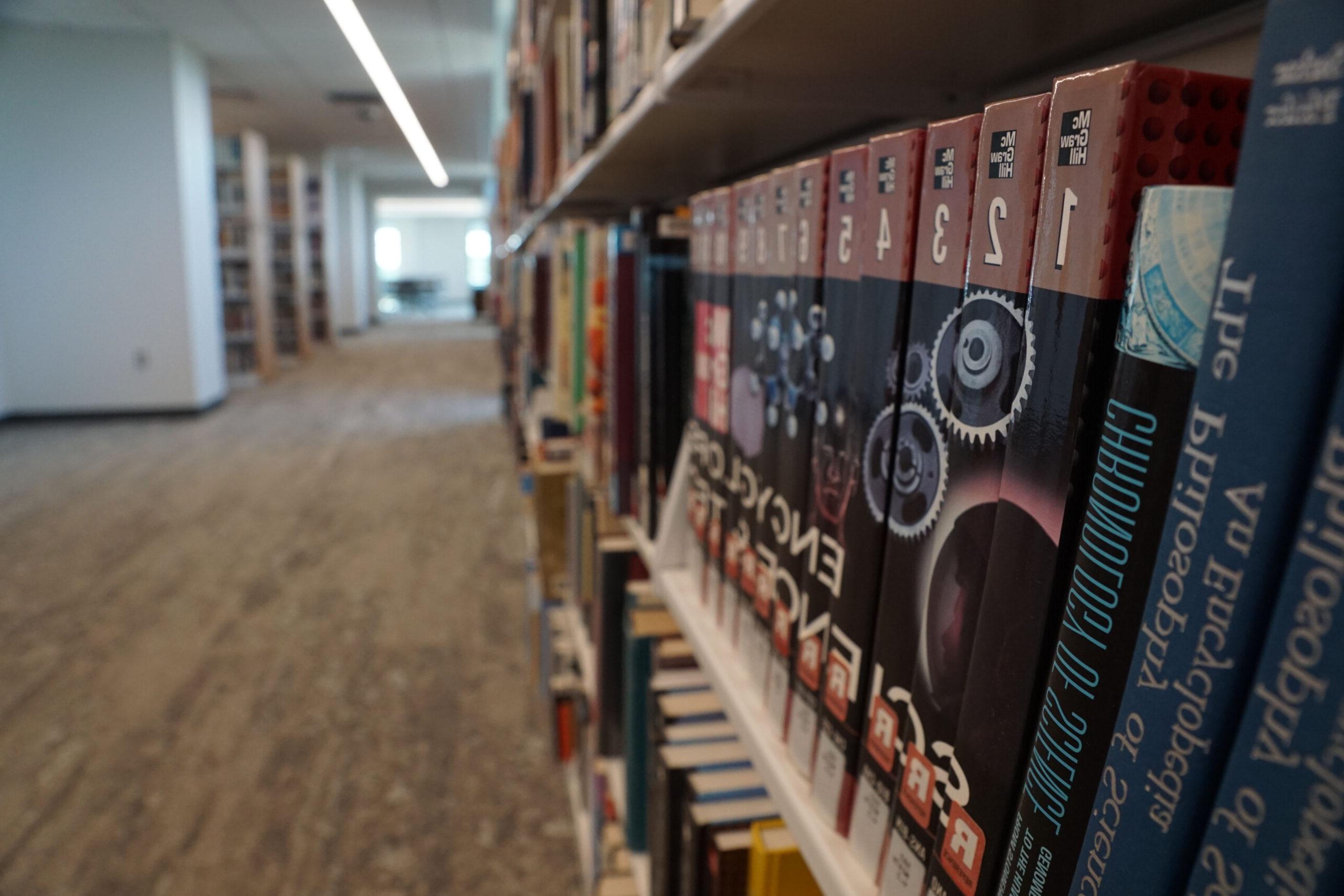 Close up of reference books on a shelf in the library